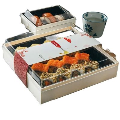 Le sushi japonais de déjeuner de boîte jetable à emporter à sushi enferme dans une boîte l'emballage de papier